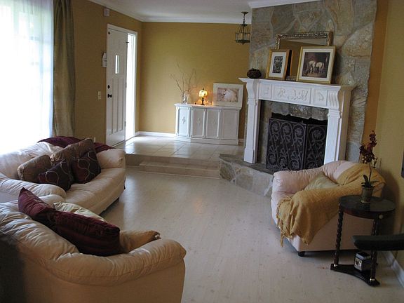 STONE FIREPLACE IN FORMAL LIVING ROOM