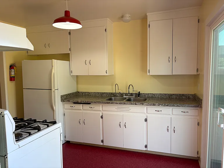 Kitchen, fridge/freezer, filtered water tap, sliding glass door to back deck
