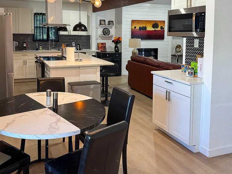 Dining room with kitchen in the backrgound
