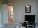 3rd bedroom has lanai overlooking pool