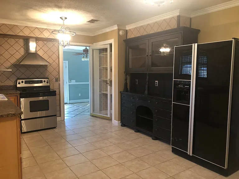 Kitchen with country chick style cabinetry.