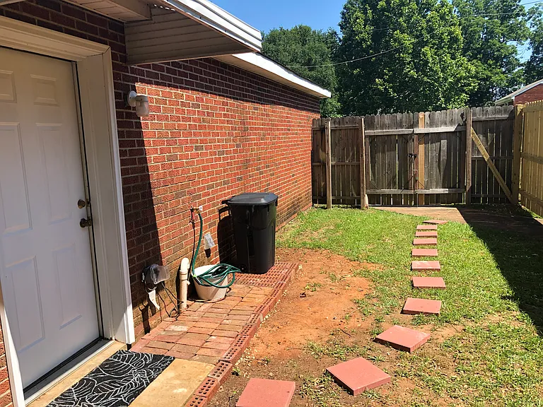 Back door to fenced yard and gate to front yard
