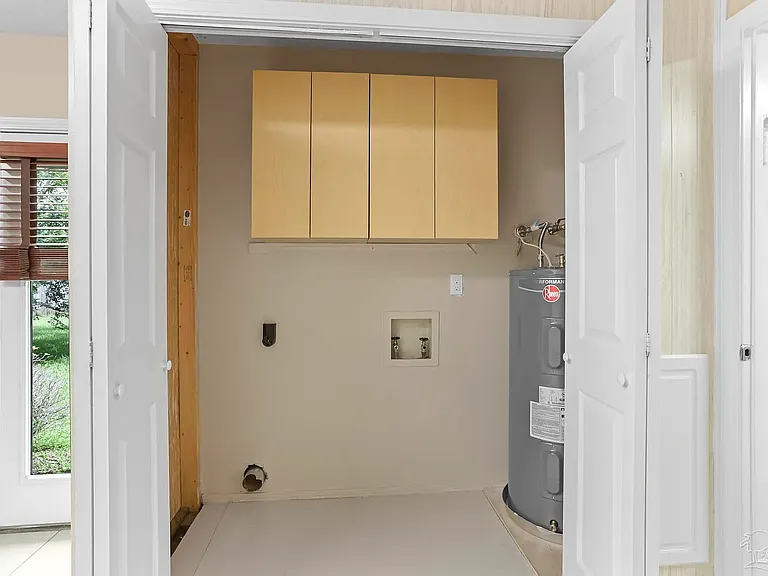 Washer and dryer hooks-up. Laundry cabinet