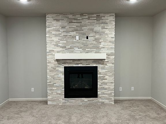 stack stone fireplace surround,
mantel is ready for TV or art