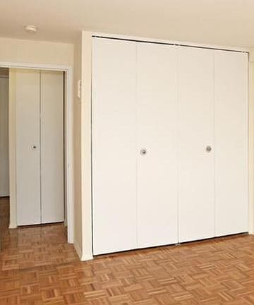 Bed Room Closet and View of Linen Closet