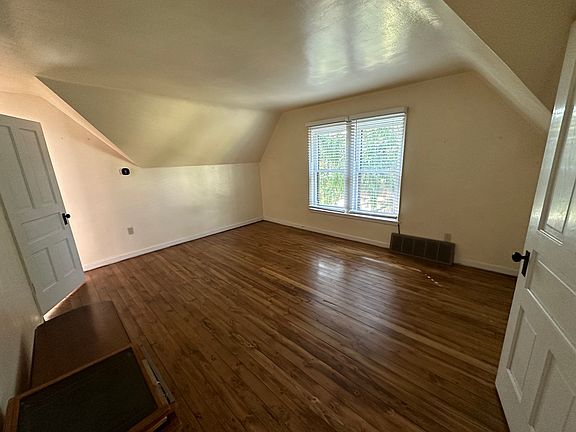 Large living room with wood floors.