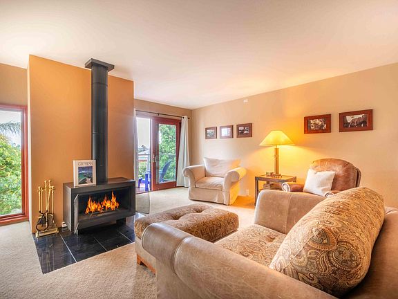 Master Bedroom with fireplace and patio