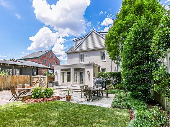 Back yard with stone patio.