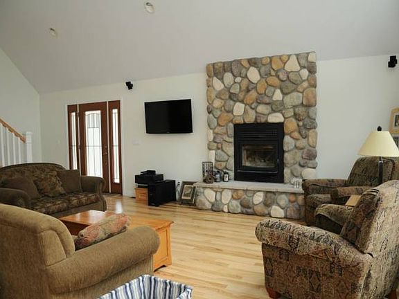 Wood burning fireplace adds warmth.