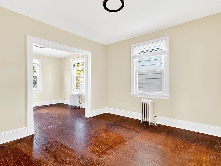 Bedroom with hardwood floors.