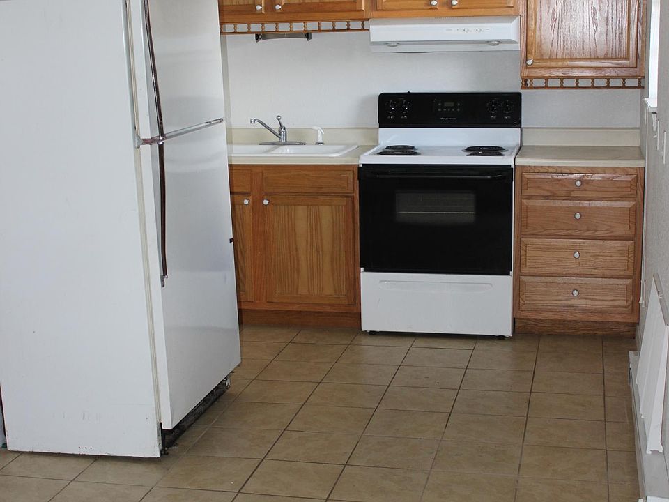 Kitchen with stove and refrigerator.