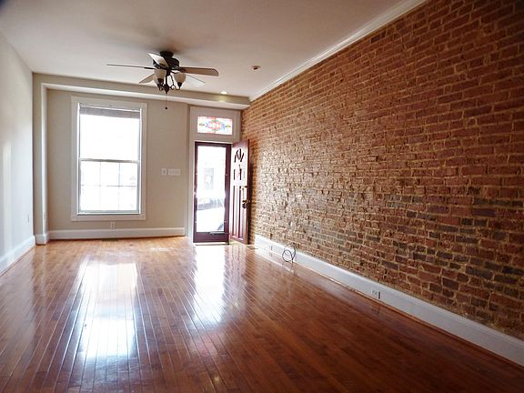 Open Living & Dining Area w/ Exposed Brick!