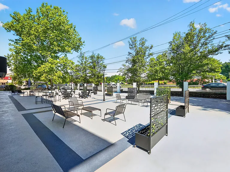 Relax in the inviting outdoor lounge at Eagle Rock Apartments at Framingham, where modern design meets tranquility. Enjoy sun-soaked seating and lush greenery, perfect for unwinding or socializing. Explore your next home today!