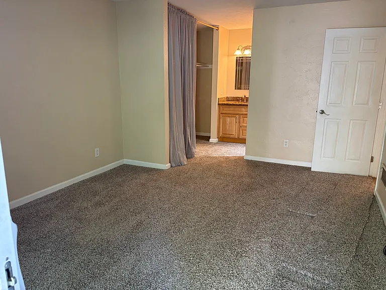 New carpet throughout. Master bedroom has vanity outside master bath and view of gorgeous private back yard.