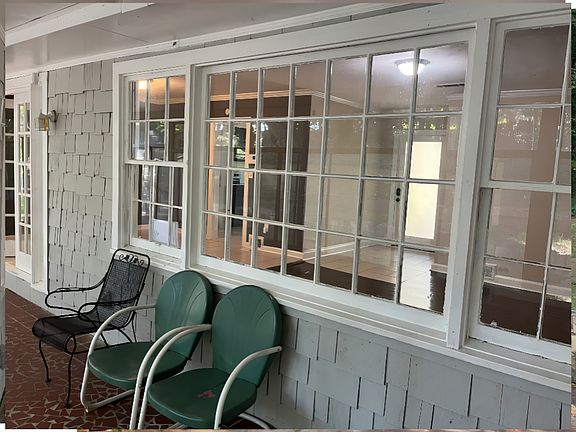 Attached rear sunroom with view into home