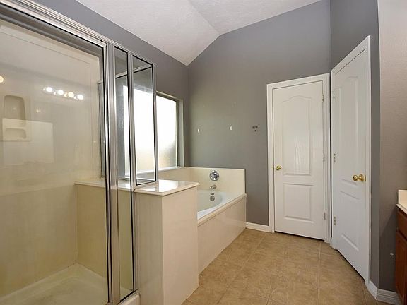 To the right as you enter the home is the study with glass French doors.