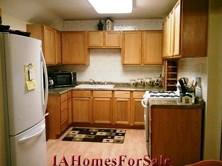 Updated Kitchen with lots of cupboard and drawer space and built in wine rack-Newer appliances stay.