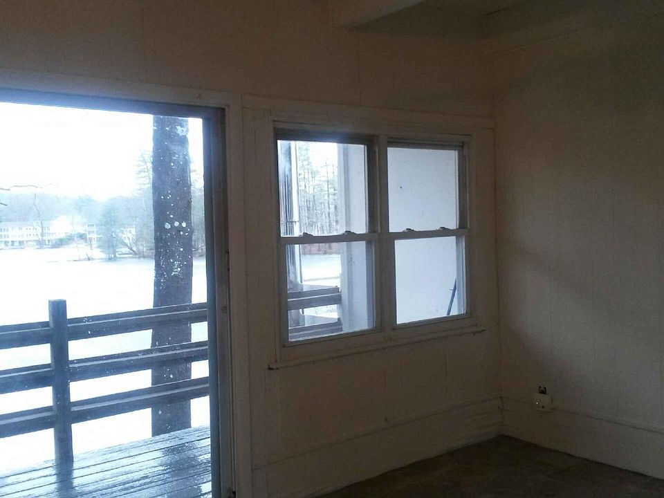 Living room sliders to deck overlooking lake