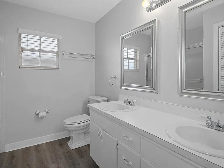Master bath with tub/shower and his/her sinks