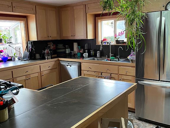 New modern kitchen with garden window and skylight
