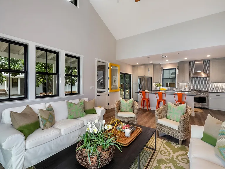 Living room area with Kitchen behind.