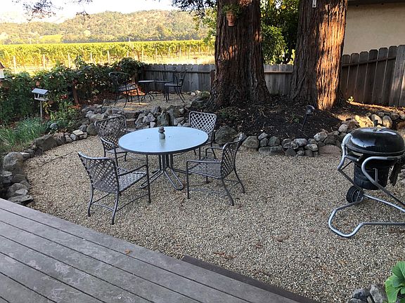 Many a morning and evening will be spent in the backyard, framed by massive redwoods which provide welcoming shade in the warm summers