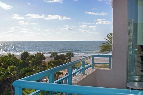 Private wrap around balcony has SW Gulf views.