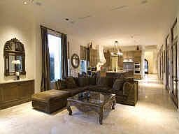 View of open Family Room (20 X 18) with abundant natural light, stone floors, high ceilings, surroun