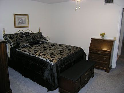 Bedroom with Dresser, night stands and large closet