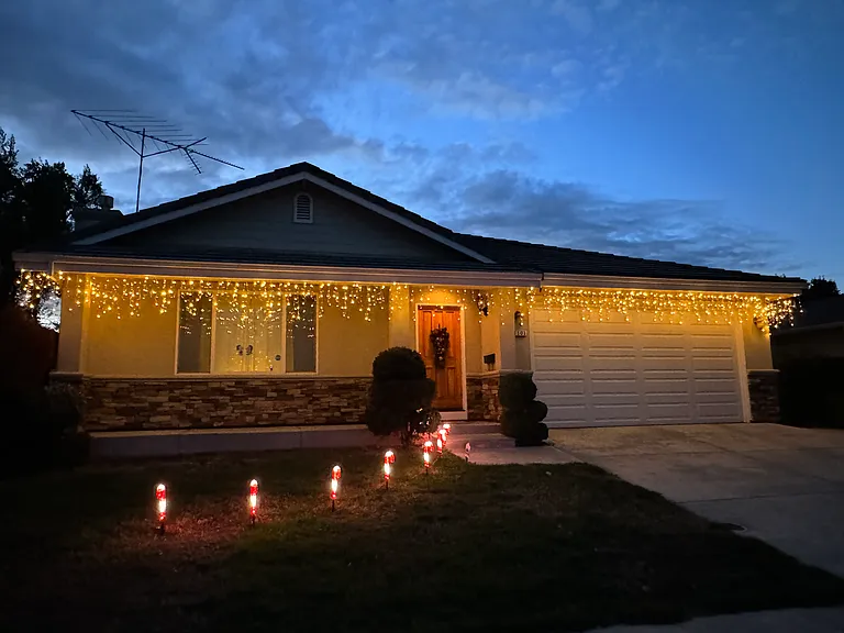 Front Yard- Integrated exterior power outlets illuminate stunning seasonal lighting displays, creating a warm, magical welcome home that beautifully enhances the neighborhood's curb appeal.