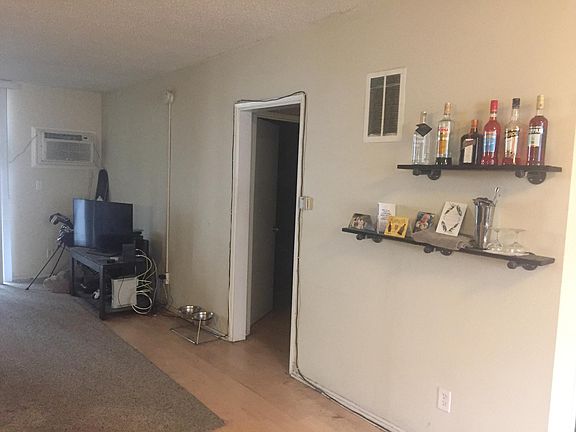 More dining room w/shelves plus hallway leading to a closet/