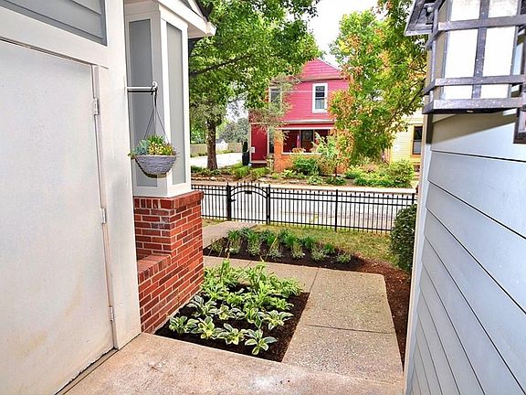 224 E 13th Street, Unit#B, Indianapolis, IN 46202. Southern exposures and fenced yard on a quiet street. Extra storage closet is accessible from the front porch.