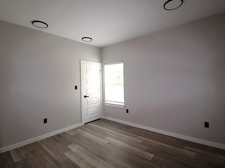 Bedroom 3 of 4 featuring modern flooring, recessed lighting, natural light, and a spacious closet.