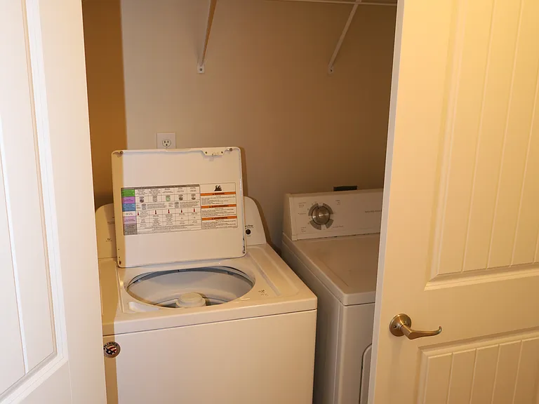 Washer and dryer included, behind doors