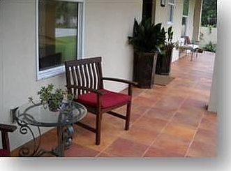 Front Porch West
						:
						Porcelain tile, finished ceilings