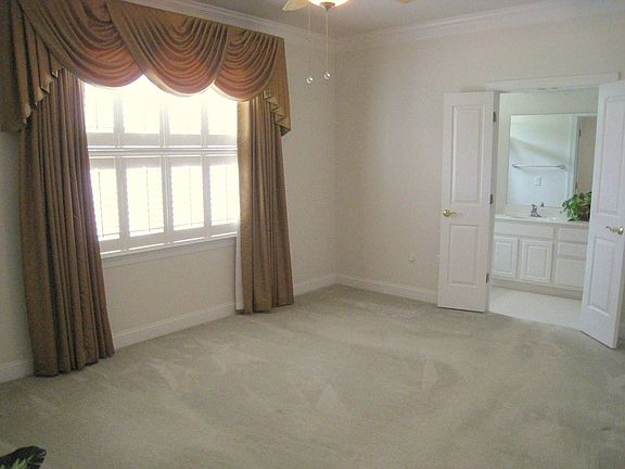 Spacious master with plantation shutters