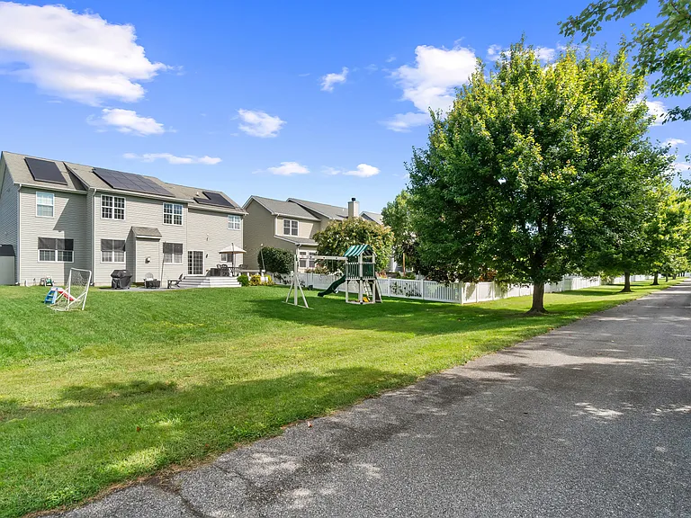 Rear of home faces the Kent Island Resort. A single home's private driveway is pictured, located at the rear of the house.