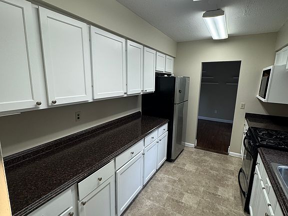 Kitchen with gas stove and dishwasher.