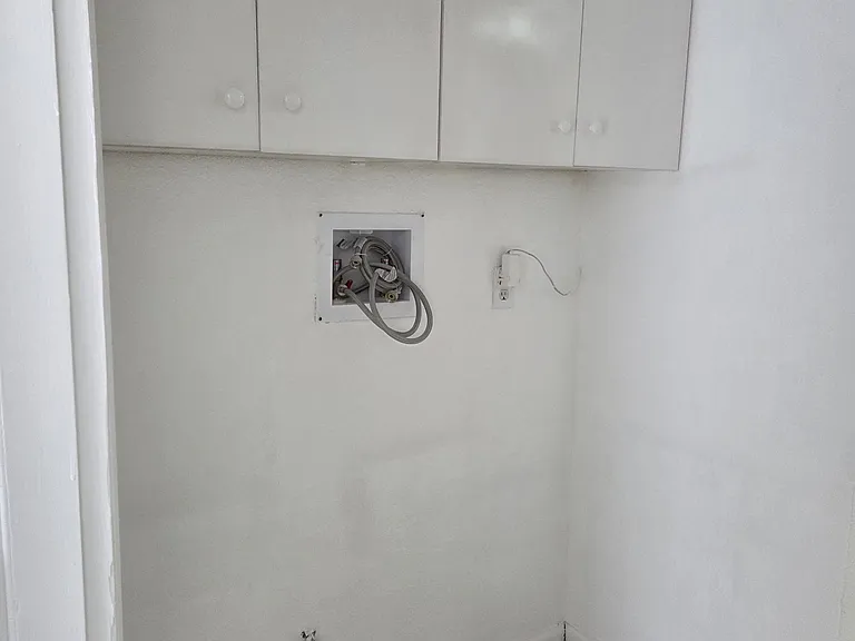 Washer and dryer hookup
Wash area cabinets