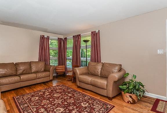 Exposed hardwood floors in the living room.