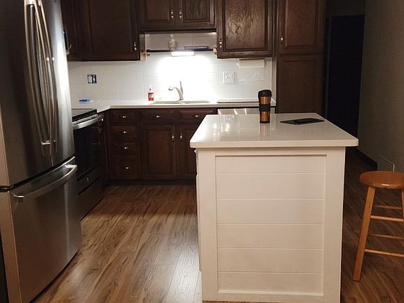 Kitchen showing sink and island