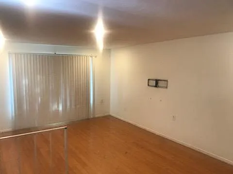 Big living room. Item on the wall is the mounting hardware for a big TV.