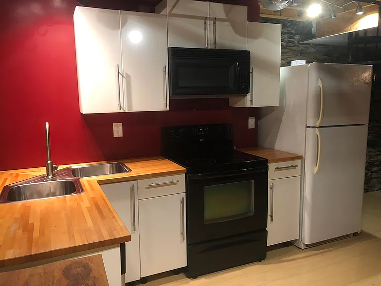 Kitchen - dishwasher, microwave, full size stovetop/oven, and full size refrigerator with freezer on top