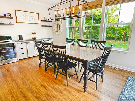 Inside, you'll find a bright, open floor plan that's made for real life. The gourmet kitchen is the heart of this home, featuring an oversized quartz island and adjacent dining room for gatherings, with line of sight into the family room and backyard.