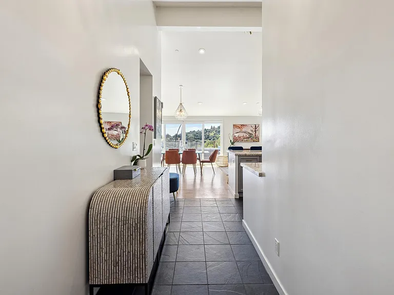Entry into great room (kitchen, living, dining, bar w/custom wine cellars)