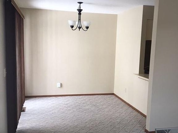 Dining room with peek thru to kitchen and sliding glass door