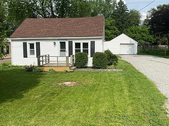 Front view and 1 1/2 car garage