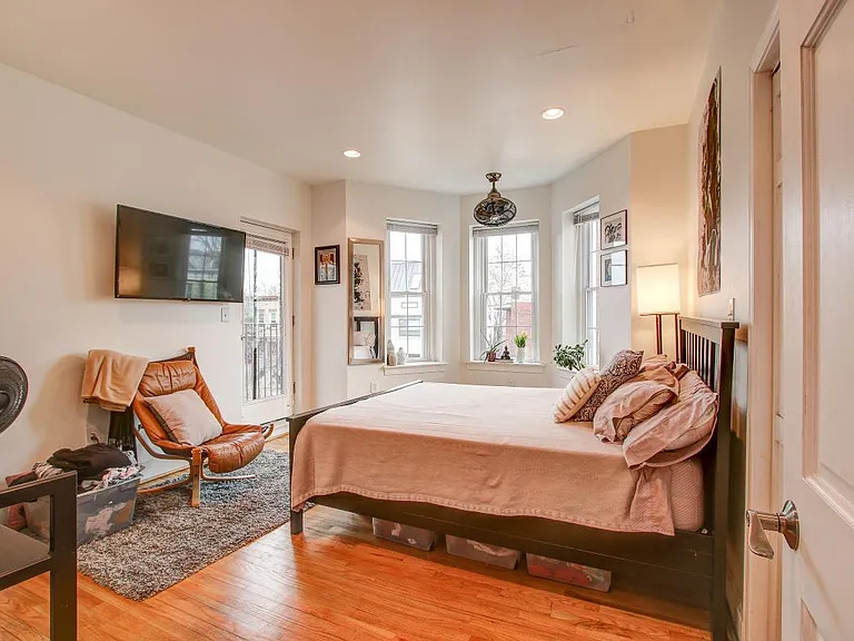 Second Master with balcony and ensuite full bath. Views of the Capital dome.