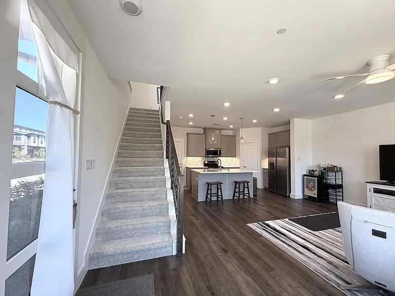 A clean and well-maintained staircase leads to the second floor.