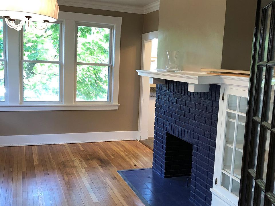 Dining Room 
mantel, built in china cabinet, chandelier, crown molding, & hardwood floors